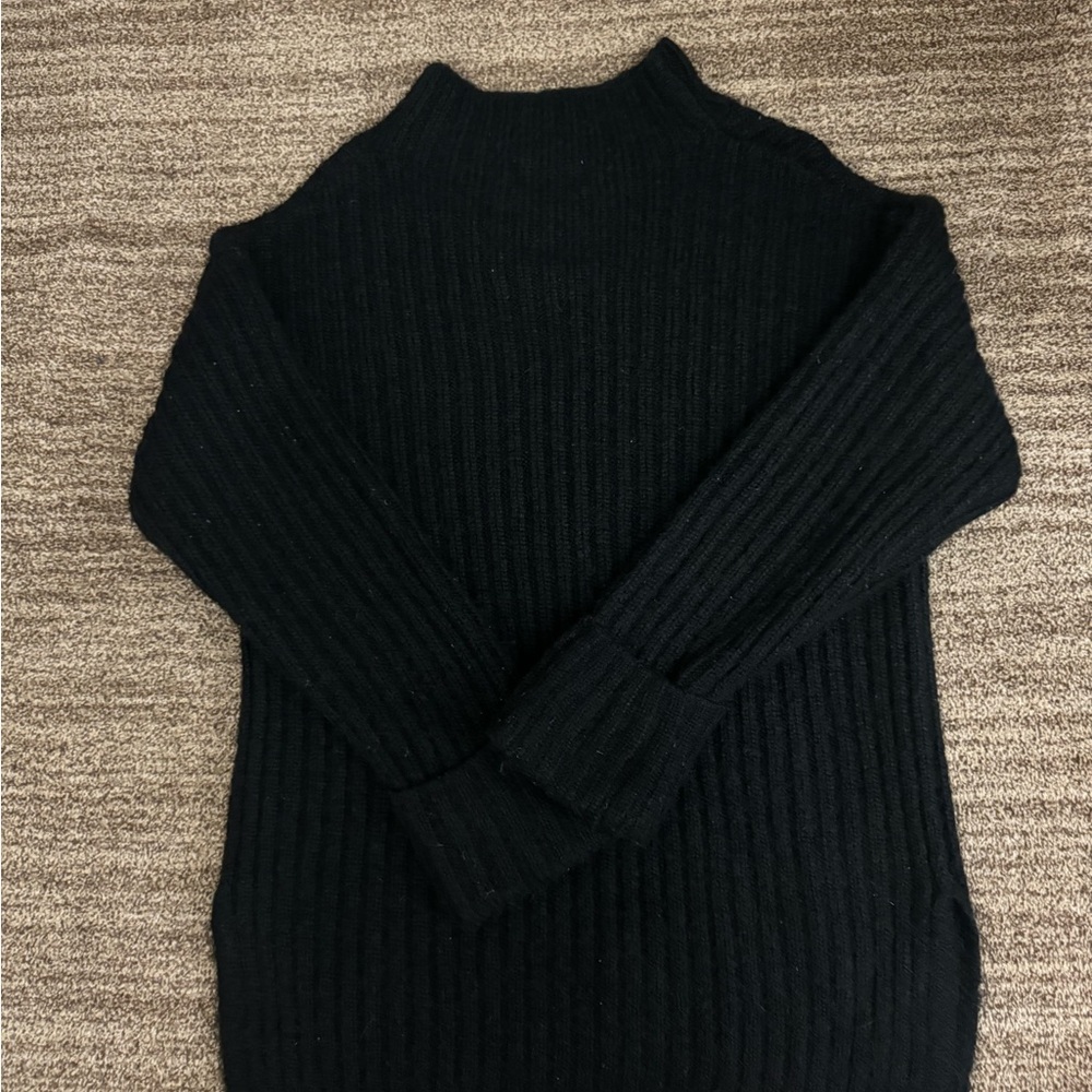 A black Old Navy cowl neck sweater in the size small.